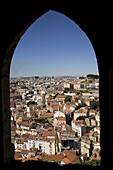 An arched window at the Castelo Sao Jorge (Castle of St. George) provides a view of Lisbon, Portugal, Europe