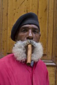 Revolutionary man smoking a cigar, Havana, Cuba, West Indies, Caribbean, Central America