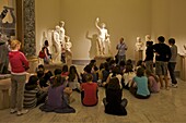Schoolchildren learning about Roman sculpture at the National Archaeological Museum in Naples, Campania, Italy, Europe