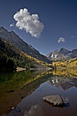 Maroon Bells reflected in Maroon Lake with fall color, White River National Forest, Colorado, United States of America, North America