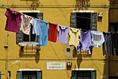 Clothes hanging on a washing line between houses, Venice, UNESCO World Heritage Site, Veneto, Italy, Europe