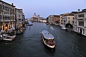 Evening view of a vaporetto (water bus) on the Grand Canal, Venice, UNESCO World Heritage Site, Veneto, Italy, Europe