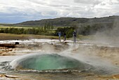 Strokkur, the unique dome of water that rises at the start of each powerful eruption of the geyser that erupts every 10 minutes, beside the now-inactive Geysir, southeast Iceland, Iceland, Polar Regions