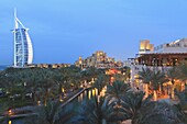 Burj Al Arab viewed from the Madinat Jumeirah Hotel at dusk, Jumeirah Beach, Dubai, United Arab Emirates, Middle East