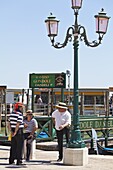 Gondoliers chatting, Venice, Veneto, Italy, Europe