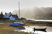Early morning view of Loch Carron with sunlight bursting over distant hills, Plockton, Kintail, Highlands, Scotland, Europe