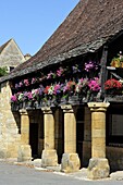 Flower bedecked medieval Les Halle, Bastide town of Domme, one of Les Plus Beaux Villages de France, Dordogne, France, Europe