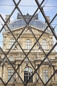 The Louvre viewed through the Pyramid, Paris, France, Europe