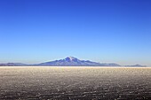 Salar de Uyuni salt flat and Mount Tunupa, Andes mountains in the distance in south-western Bolivia, South America