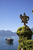 Passenger boat in spring sunshine off Villa Balbianello, Lenno, Lake Como, Lombardy, Italian Lakes, Northern Italy, Europe
