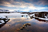Winter view across Lochain na h'achlaise to the Black Mount hills at dusk, Rannoch Moor, Highland, Scotland, United Kingdom, Europe