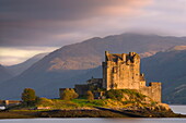 Eilean Donan Castle bathed in evening light, Loch Duich, near Kyle of Lochalsh, Highland, Scotland, United Kingdom, Europe