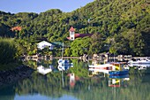 The harbour and church, Baie Sainte Anne, Baie Sainte Anne district, Island of Praslin, Seychelles, Indian Ocean, Africa