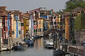 Pastel coloured houses alongside a canal in Burano, Venetian Lagoon, Venice, Veneto, Italy, Europe