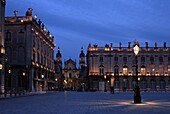 Evening floodlit view of Place Stanislas and the cathedral, UNESCO World Heritage Site, Nancy, Lorraine, France, Europe