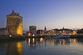 St. Nicholas and La Chaine towers at the entrance to the ancient port of La Rochelle, Charente-Maritime, France, Europe