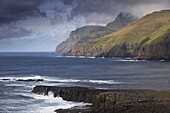 Sea cliffs and surf near Famjin (Logvatangi, Brimnestangi), on Suduroy west coast, Suduroy Island, Faroe Islands (Faroes), Denmark, Europe