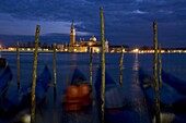 Gondolas at dusk on the Venice Lagoon and San Giorgio di Maggiore behind, Venice, UNESCO World Heritage Site, Veneto, Italy, Europe