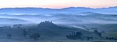 Misty dawn panoramic view towards Belvedere, across Val d'Orcia, UNESCO World Heritage Site, San Quirico d'Orcia, near Pienza, Tuscany, Italy, Europe