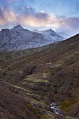 Sunset on snowy mountains, Skumhottur, 1229m, in Reydarfjordur fjord, East Fjords, Iceland, Polar Regions