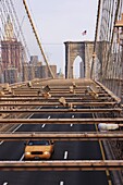 Taxi crossing Brooklyn Bridge, New York City, New York, United States of America, North America