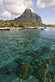 Turquoise water and the Beachcomber Le Paradis five star hotel, with Mont Brabant in the background, Mauritius, Indian Ocean, Africa