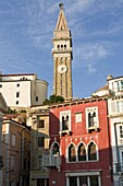 Free standing bell tower of Cathedral of St. Georges between houses, Piran, Slovenia, Europe