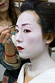Geisha having her make-up applied, Kyoto, Kansai region, Honshu, Japan, Asia