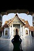 Woman taking pictures, Wat Benchamabophit (Marble Temple), Bangkok, Thailand, Southeast Asia, Asia