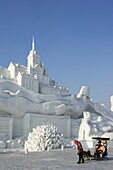 Dog sled ride at the Snow and Ice Sculpture Festival at Sun Island Park, Harbin, Heilongjiang Province, Northeast China, China, Asia