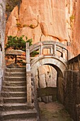 Steps, bridge, and last sunrays on rock face, White Cloud scenic area, Huang Shan (Yellow Mountain), UNESCO World Heritage Site, Anhui Province, China, Asia