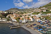 Fishing boats in the small south coast harbour of Camara de Lobos, Madeira, Portugal, Atlantic, Europe