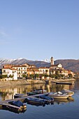 Boats and town houses on waterfront in Feriolo, Lake Maggiore, Italian Lakes, Piedmont, Italy, Europe