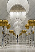 Gilded columns leading to the main prayer hall of Sheikh Zayed Bin Sultan Al Nahyan Mosque, Abu Dhabi, United Arab Emirates, Middle East