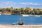 Outrigger boat lying on bank of sand, Antsanitian Beach Resort, Mahajanga, Madagascar, Indian Ocean, Africa