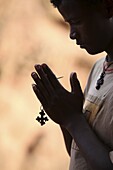 Young man praying in Lalibela, Ethiopia, Africa