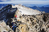 Climbers on summit of Pico de Aneto, at 3404m the highest peak in the Pyrenees, Spain, Europe