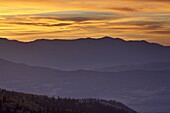 Orange clouds at sunset over layered mountains, Manti-La Sal National Forest, Utah, United States of America, North America