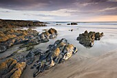 Low tide at sunset on Coombesgate Beach at Woolacombe, Devon, England, United Kingdom, Europe
