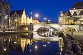 Reflection of arched bridge and waterfront town houses, Ghent, Flanders, Belgium, Europe