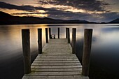 A wooden jetty stretches out into Derwent Water, Lake District National Park, Cumbria, England, United Kingdom, Europe