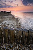 The summer sun rises over Southampton Water, Calshot, Hampshire, England, United Kingdom, Europe