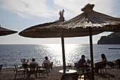 People relaxing on the beach at Budva on the Adriatic coast, Budva, Montenegro, Europe