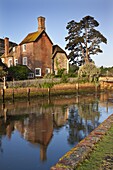 The 16th century Mill House beside Beaulieu River, New Forest, Hampshire, England, United Kingdom, Europe