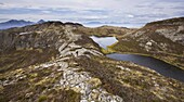 Walking along the pitchstone ridges on Eigg, Inner Hebrides, Scotland, United Kingdom, Europe