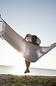 Woman on a hammock on the beach, Florida, United States of America, North America