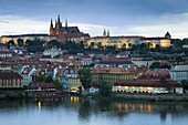 St. Vitus Cathedral, River Vltava and the Castle District illuminated in the evening, UNESCO World Heritage Site, Prague, Czech Republic, Europe