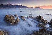 Dawn over the Seaward Kaikoura Mountain range from Kaikoura Peninsula, South Island, New Zealand, Pacific