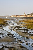 Low tide in Chichester Harbour, looking across to the ancient village of Bosham, West Sussex, England, United Kingdom, Europe