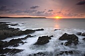 Sun setting over the Atlantic, viewed from Woolacombe Bay in Devon, England, United Kingdom, Europe